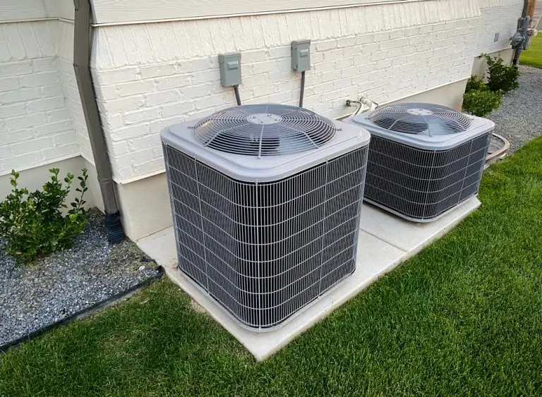 Two AC condenser units installed outside a Southern California home