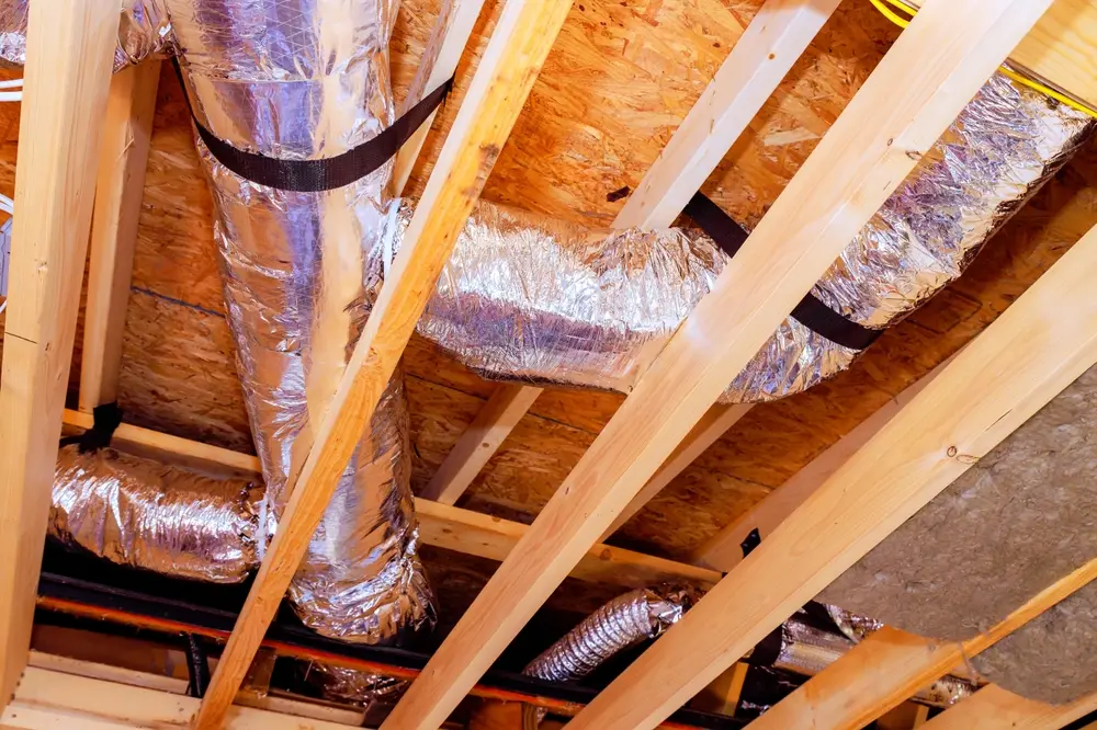 Flex ductwork installed in a residential attic during an HVAC system replacement