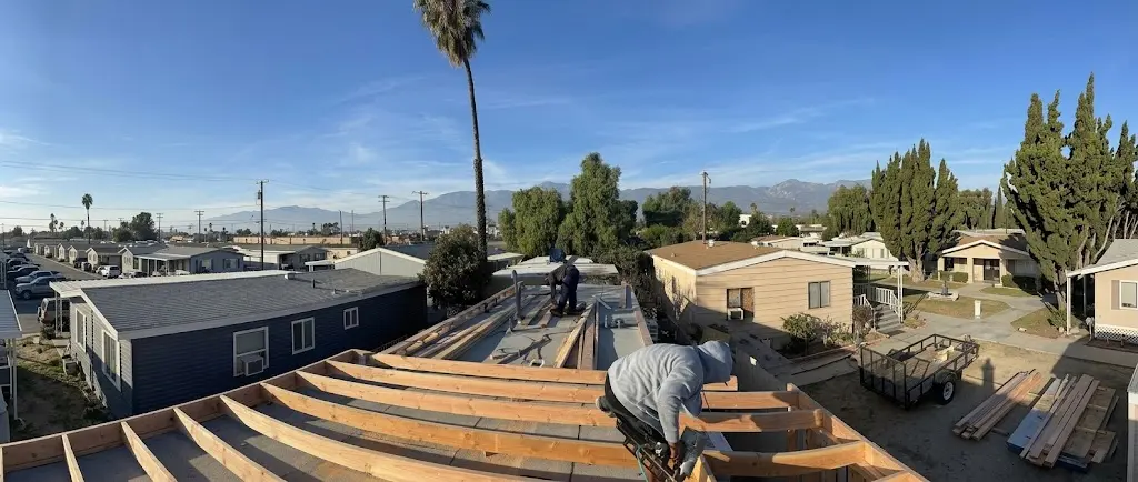 Roofing crew working on a residential roof installation in Southern California