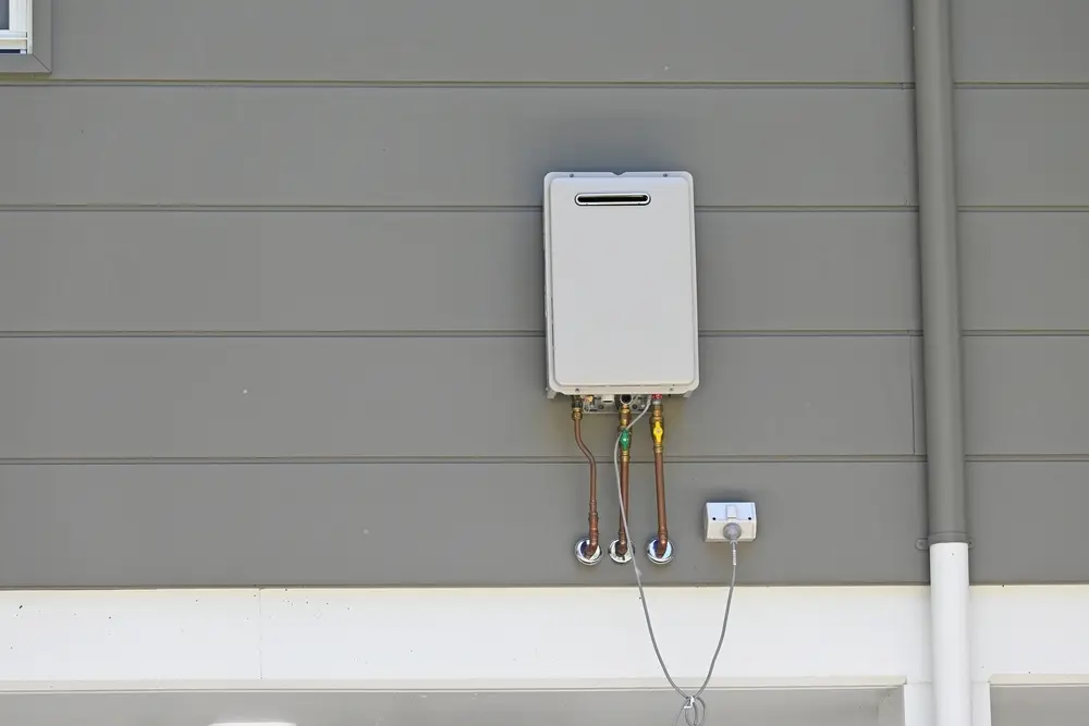 Tankless water heater mounted on exterior wall of a Southern California home