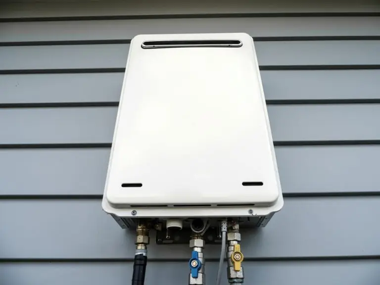 Tankless water heater installed on the exterior of a residential home