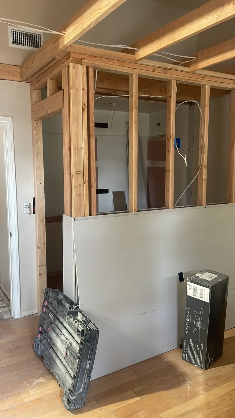 new non-metallic cable run through an open stud wall during a rewire